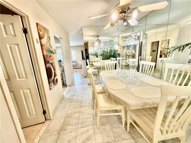 dining area with a ceiling fan