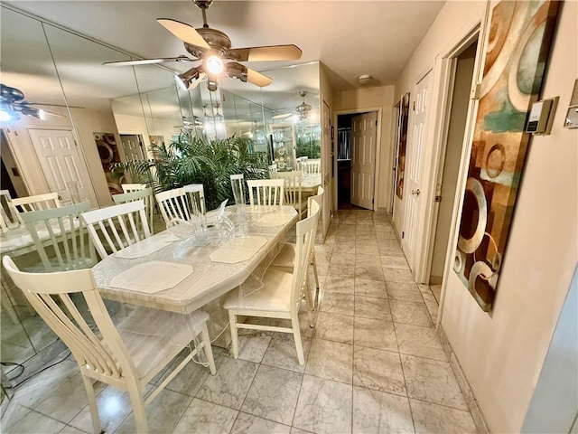 dining room with a ceiling fan