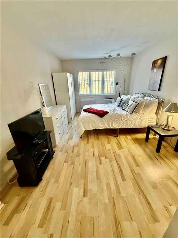 bedroom with light wood finished floors