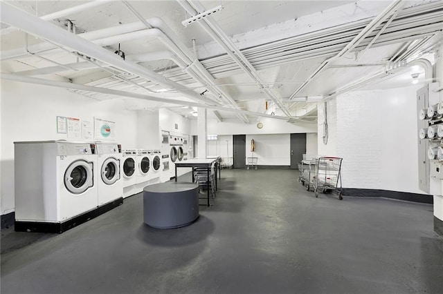 common laundry area with washing machine and dryer and baseboards