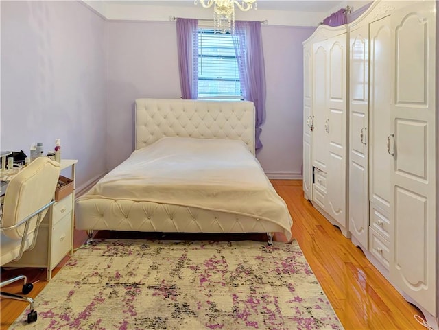 2375 Ocean Ave Unit 3H, Brooklyn, NY 11229 - bedroom featuring a closet, a chandelier, and light wood-style floors