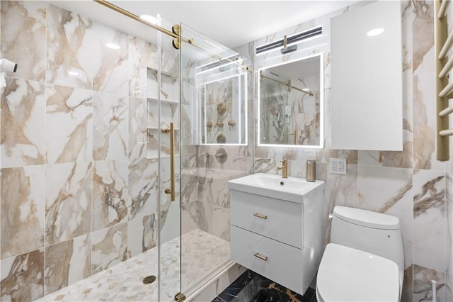 bathroom with toilet, a marble finish shower, and vanity