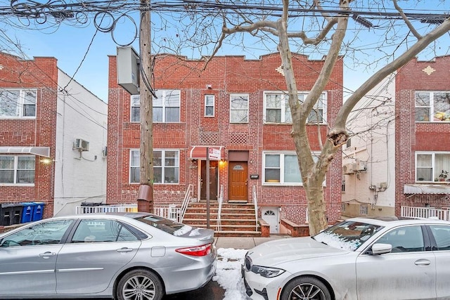 view of property featuring brick siding