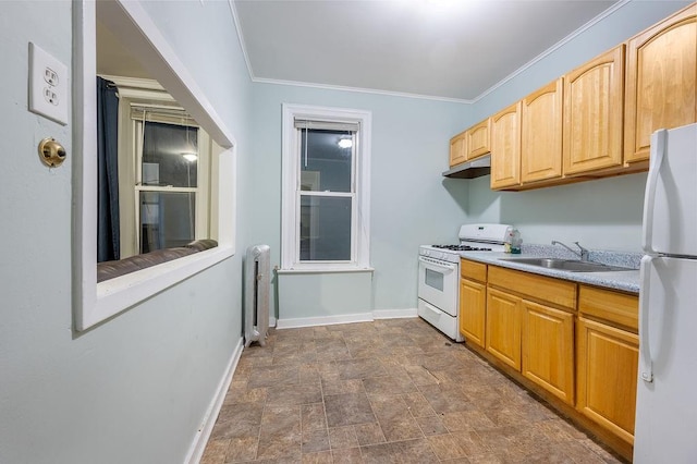 kitchen featuring white appliances, baseboards, radiator, under cabinet range hood, and a sink