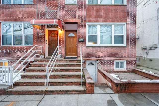 property entrance with brick siding