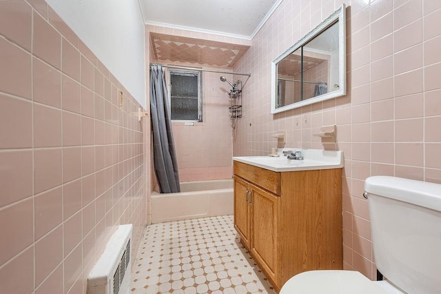 full bath featuring toilet, shower / tub combo, tile walls, and vanity