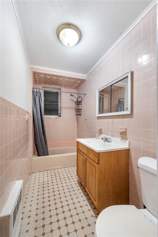 full bath with toilet, ornamental molding, tile walls, and vanity