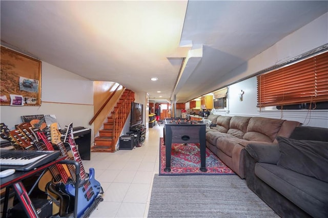 living room with stairs, light tile patterned flooring, and recessed lighting