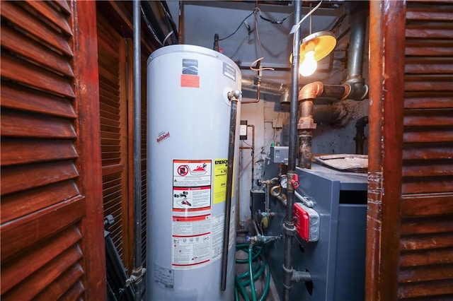 utility room with a heating unit and gas water heater