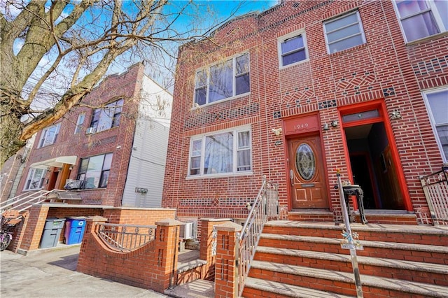 view of front of home with brick siding