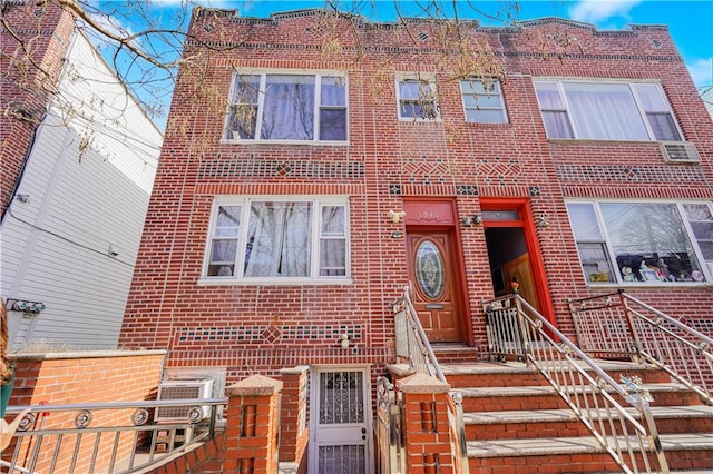 townhome / multi-family property with brick siding