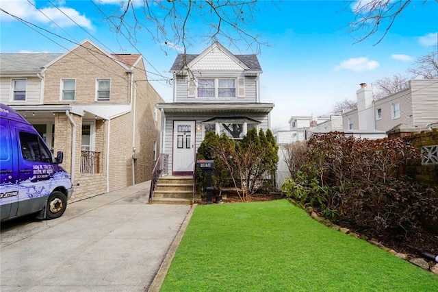 view of front of property with a front yard and fence