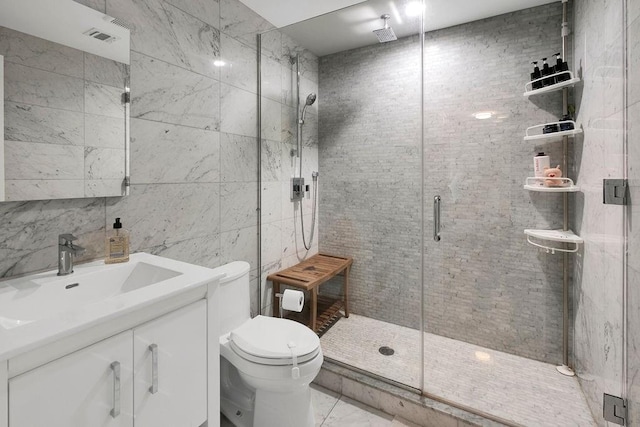 97 Battery Ave Unit 3B, Brooklyn, NY 11209 - bathroom with tile walls, a shower stall, toilet, vanity, and marble finish flooring