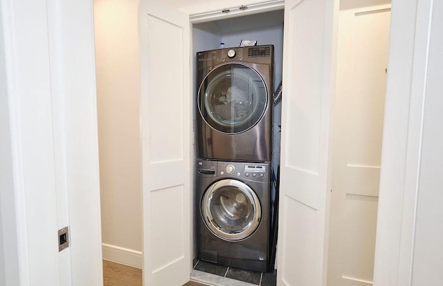 97 Battery Ave Unit 3B, Brooklyn, NY 11209 - laundry area featuring stacked washer and clothes dryer and baseboards