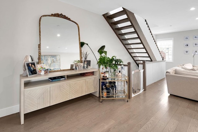 97 Battery Ave Unit 3B, Brooklyn, NY 11209 - bar with wood finished floors, stairway, recessed lighting, and baseboards