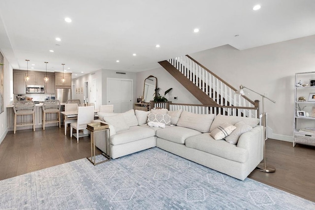 97 Battery Ave Unit 3B, Brooklyn, NY 11209 - living room with wood finished floors, recessed lighting, stairs, and baseboards