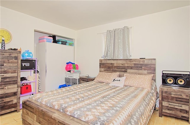 bedroom with wood finished floors