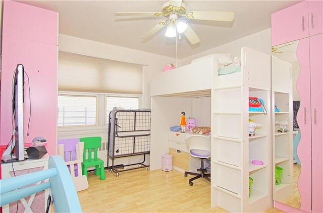 bedroom with wood finished floors