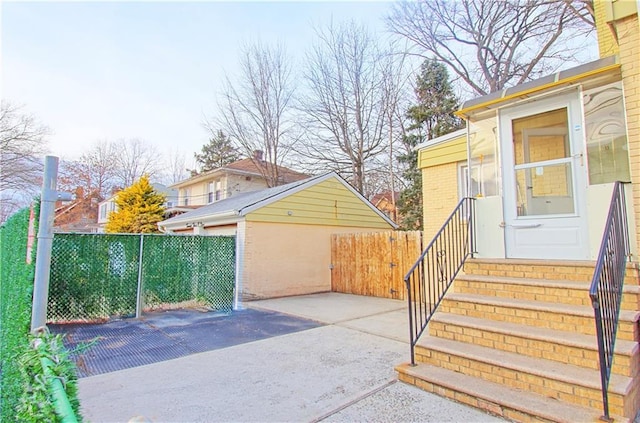 exterior space featuring an outbuilding and fence