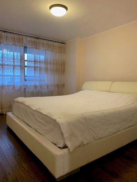 bedroom featuring wood finished floors