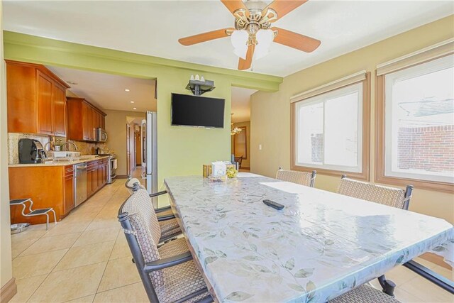 dining area featuring light tile patterned floors, a ceiling fan, and recessed lighting