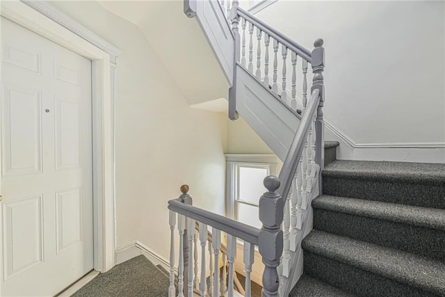 stairs featuring baseboards
