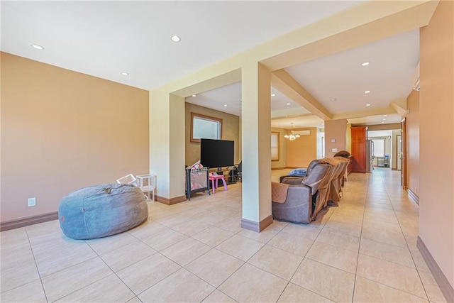 living area featuring light tile patterned floors, a chandelier, recessed lighting, baseboards, and plenty of natural light