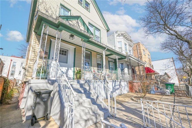 view of front of home with a porch and stairs