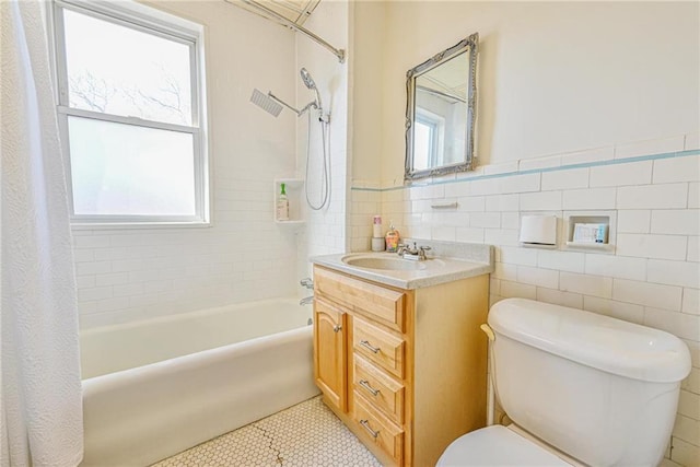 full bath featuring shower / bath combination with curtain, tile walls, and a healthy amount of sunlight