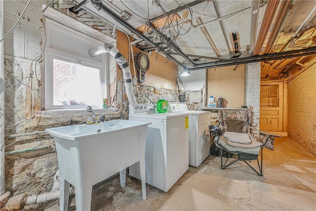 washroom with washing machine and clothes dryer and laundry area