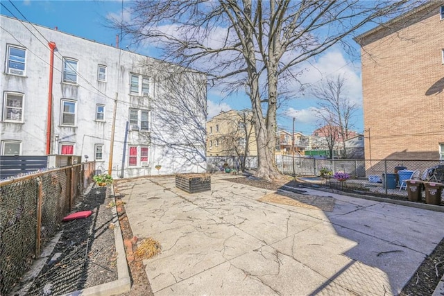 exterior space with fence and a patio area