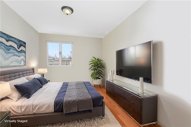 bedroom featuring light wood-type flooring