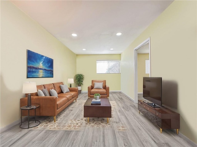 living room with recessed lighting, baseboards, and wood finished floors