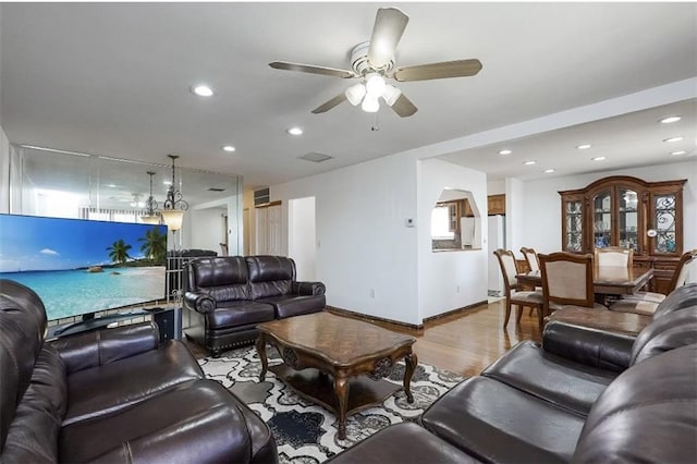 living area with visible vents, ceiling fan, baseboards, recessed lighting, and wood finished floors