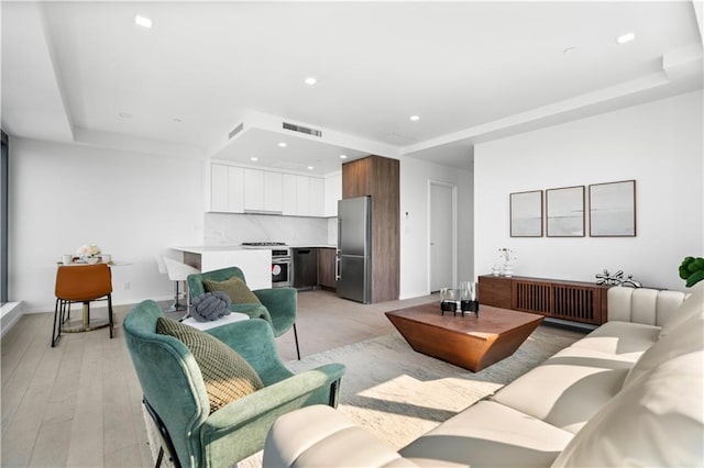2286 Cropsey Ave Unit 15E, Brooklyn, NY 11214 - living room with a tray ceiling and recessed lighting