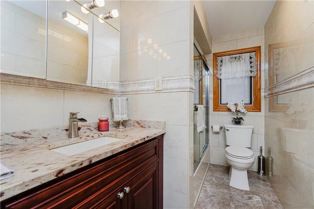 full bathroom featuring a stall shower, tile walls, and toilet