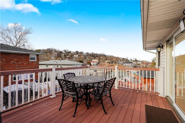 wooden deck featuring outdoor dining space