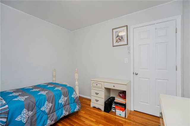 bedroom featuring wood finished floors