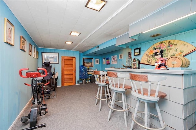 bar featuring visible vents, a dry bar, and carpet flooring