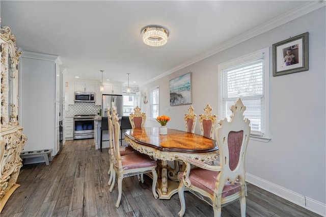 dining space with crown molding, baseboards, and dark wood-style flooring