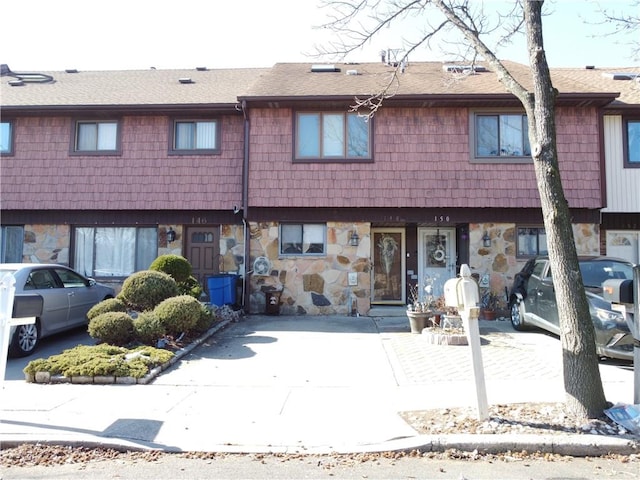 view of property with stone siding