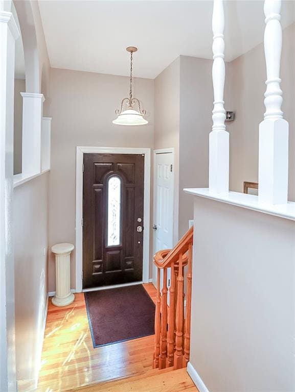 entrance foyer with light wood-type flooring and baseboards