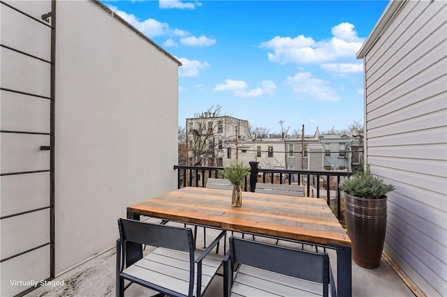 balcony featuring outdoor dining space