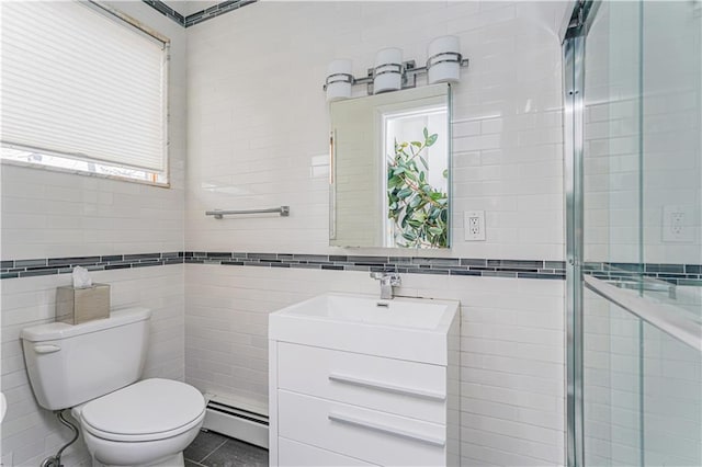 bathroom with toilet, a tile shower, tile walls, a baseboard radiator, and vanity