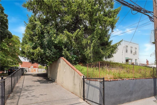 view of side of property with fence