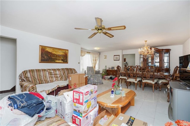 living room featuring light tile patterned floors and ceiling fan with notable chandelier