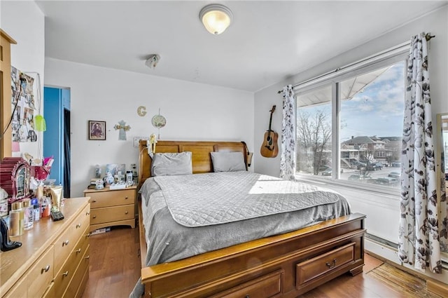 bedroom featuring wood finished floors