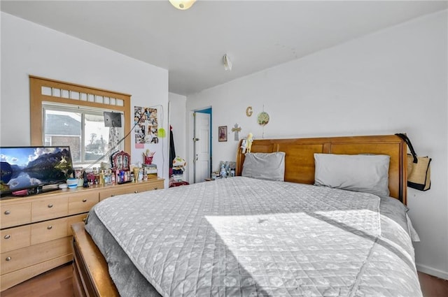 bedroom with wood finished floors