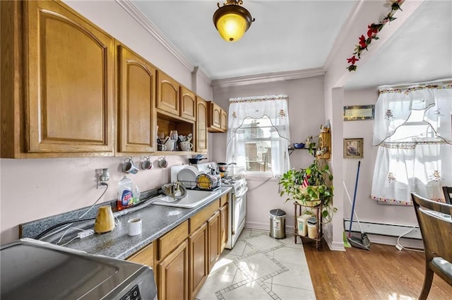 kitchen with crown molding, open shelves, baseboards, a baseboard heating unit, and brown cabinets