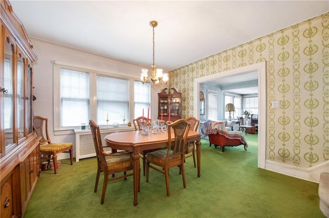 dining room with light carpet, an inviting chandelier, baseboards, and wallpapered walls